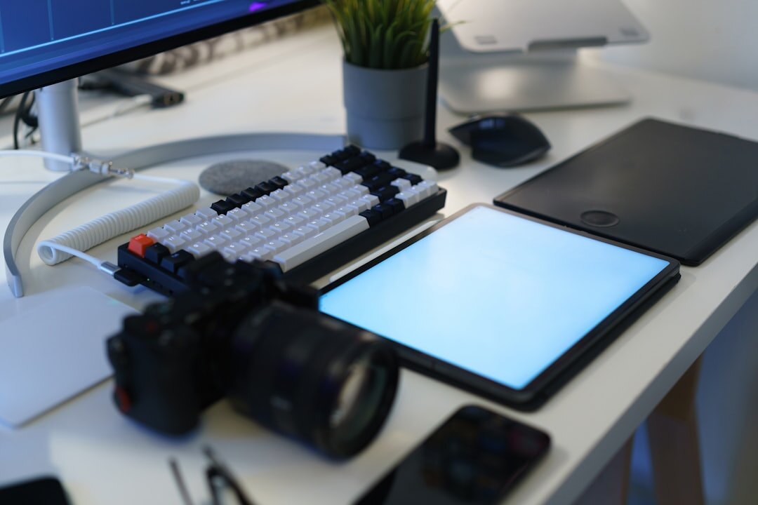 Bright editorial office desk with cameras and prints